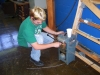 Breathitt ATC Electricity student Brandon Johnson straghtens a saw blade used to cut pipe